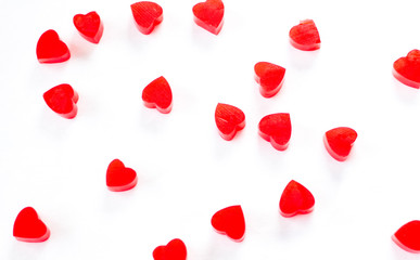 red jelly hearts on a white background