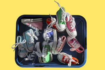 Fun time, colorful children shoes in a box