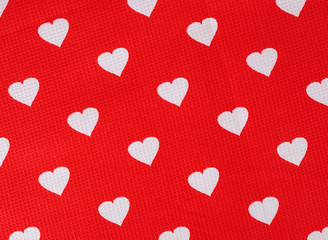Hearts pattern on red fabric texture background. Hearts on the cloth. Valentine's day concept.