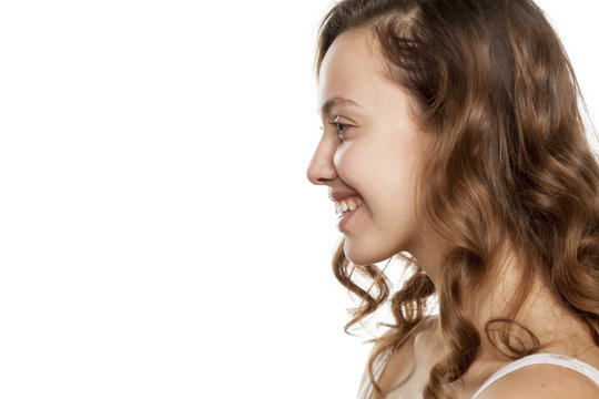 profile of smiling young woman without makeup