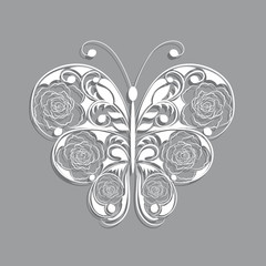 White paper butterfly with floral pattern on gray background.