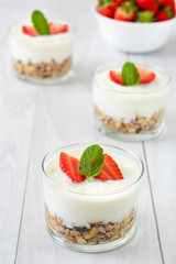 Yogurt with cereals,strawberries and milk