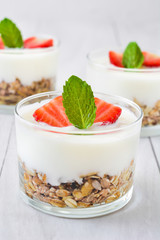 Yogurt with cereals,strawberries and milk