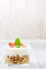 Yogurt with cereals,strawberries and milk
