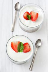 Yogurt with cereals,strawberries and milk
