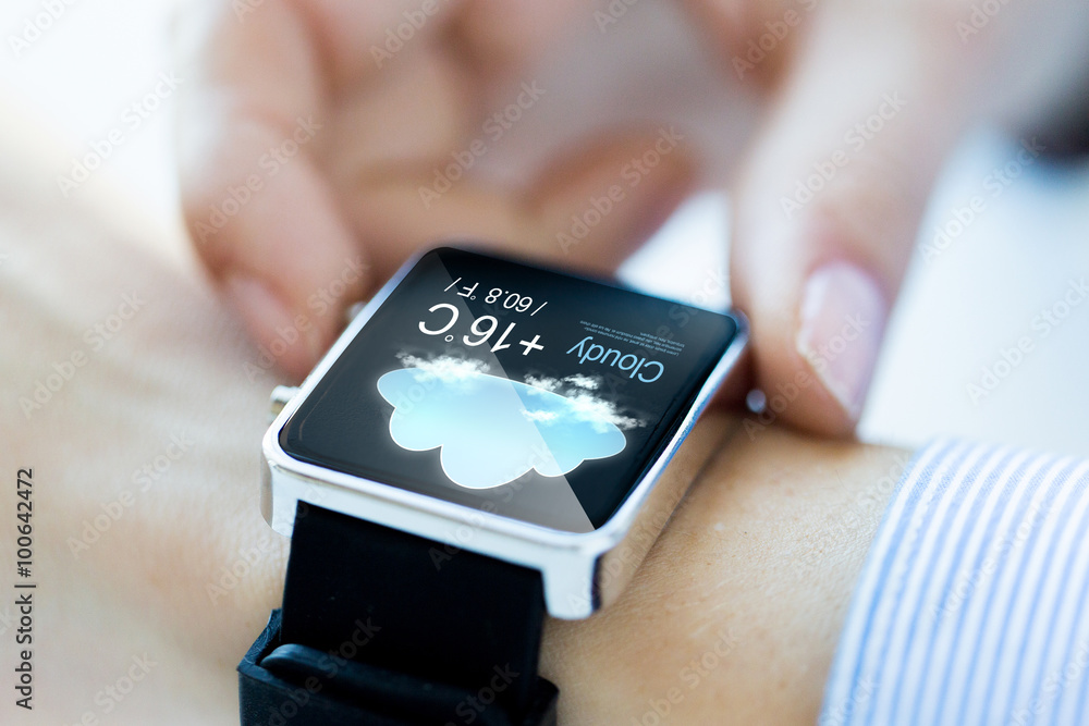 Sticker close up of hands with weather icon on smartwatch