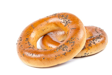 Bagels with poppy seeds on white background.