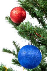 Obraz na płótnie Canvas Christmas tree with red and blue baubles