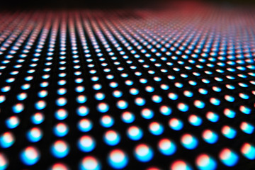 Texture of colored LED lights on a black background