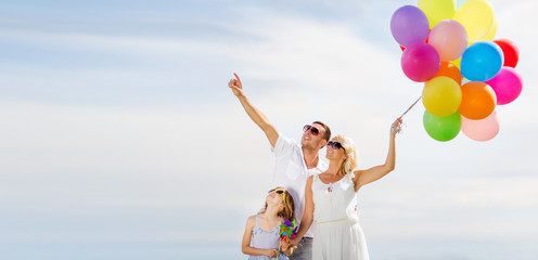 family with colorful balloons