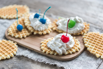 Fototapeta na wymiar Belgian waffles with whipped cream