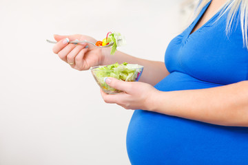 pregnant woman with healthy food