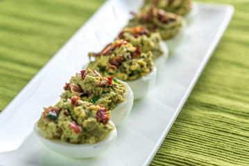 Bacon guacamole deviled eggs