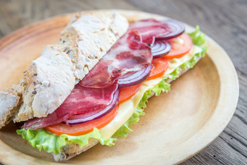 Sandwich with ham, cheese and fresh vegetables