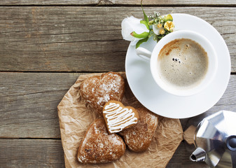 Heart shaped cookies , cup of coffee, bouquet of flowers decorat