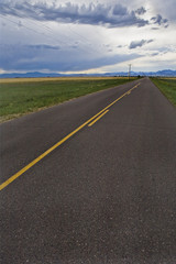 Fototapeta premium Storm clouds and highway road in Colorado