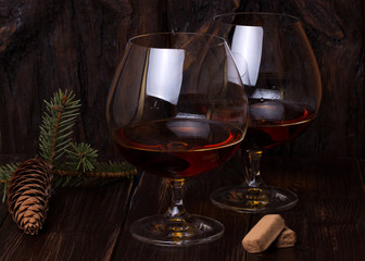 Chocolate truffles with cognac glass on the table