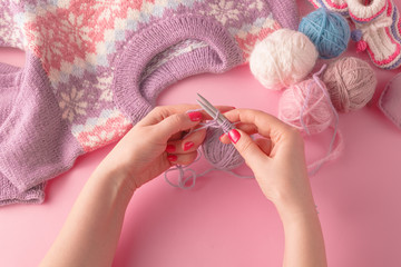 Womans hands with yarn ball and strings
