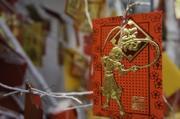 card with the image of a monkey hanging on a Christmas tree. TET coming soon. Chinese New Year
