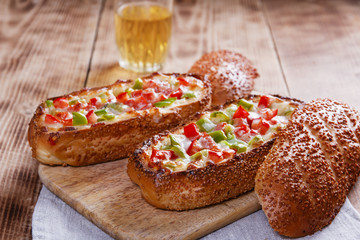 baked baguette stuffed with vegetables and cheese