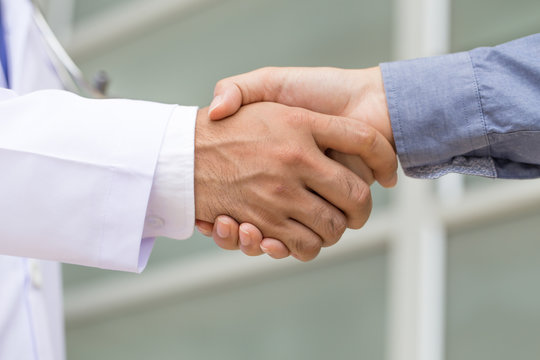 Doctor Shakes Hands With A Patient