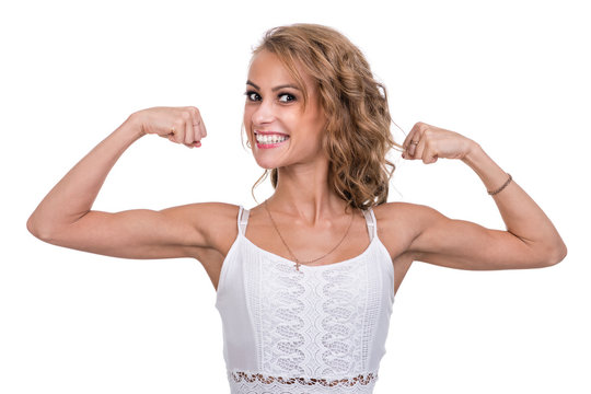 woman demonstrating biceps, isolated on white background