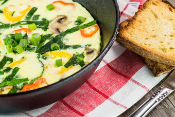 Fresh cooked omelette with vegetables.