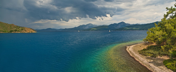 panoramic view of storm approaching islands in sea