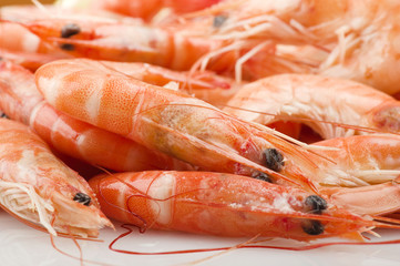 Group of fresh raw shrimp with lemon slice