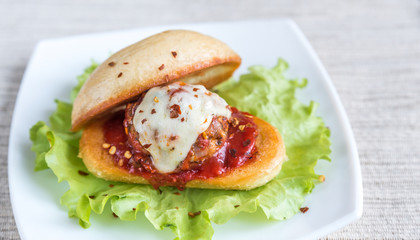 Sandwich with meatball in tomato sauce and mozzarella