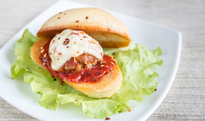 Sandwich with meatball in tomato sauce and mozzarella