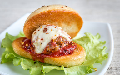 Sandwich with meatball in tomato sauce and mozzarella
