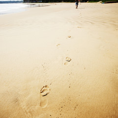 Fototapeta na wymiar Footprints on beach