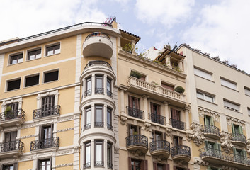 Fototapeta na wymiar The upper floors of a residential building in Barcelona