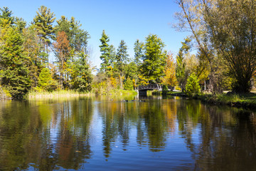 Fototapeta na wymiar Fall Colors on Scenic Pond in Ontario