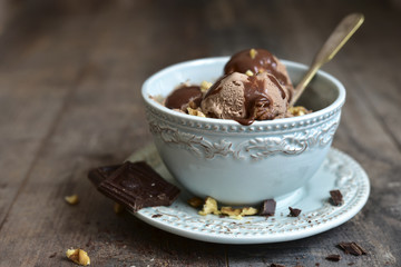 Chocolate ice cream with walnut in a vintage bowl.