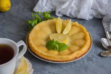 Lemon cake with mint and Cup of tea