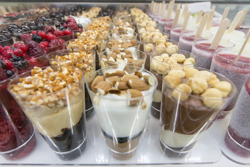 mini ice cream with various colors in the glasses