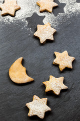 starry sky made by delicious cookies over slate background