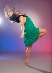 Young brunette caucasian woman dancing