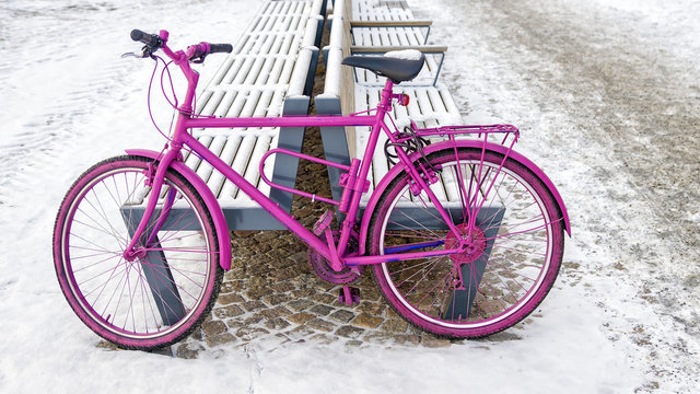 pink bike on a snowy street