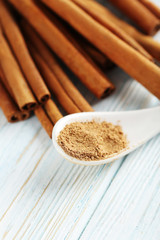Cinnamon on a blue wooden background