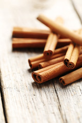 Cinnamon on a grey wooden background