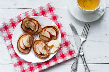 Pancakes with apple, cinnamon and honey.