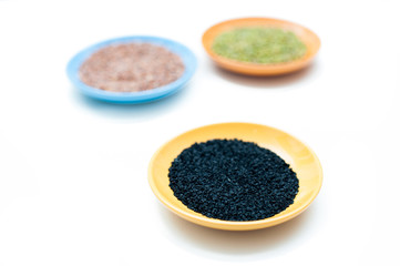 Three bowls with different seeds and selective focus