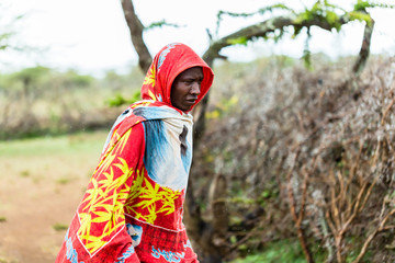 Massai man standing in the rain