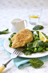 Roasted chicken breast in sesame crust.