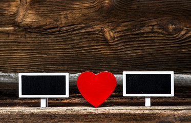 Red Wooden Heart And Two Small Blackboards On Very Old Wooden Board. Love Concept.