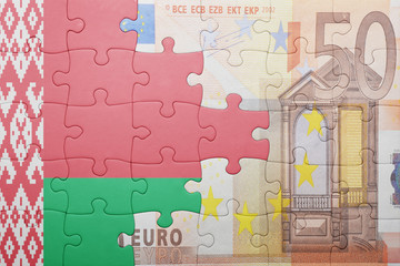 puzzle with the national flag of belarus and euro banknote