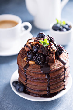 Stack Of Chocolate Pancakes With Toppings